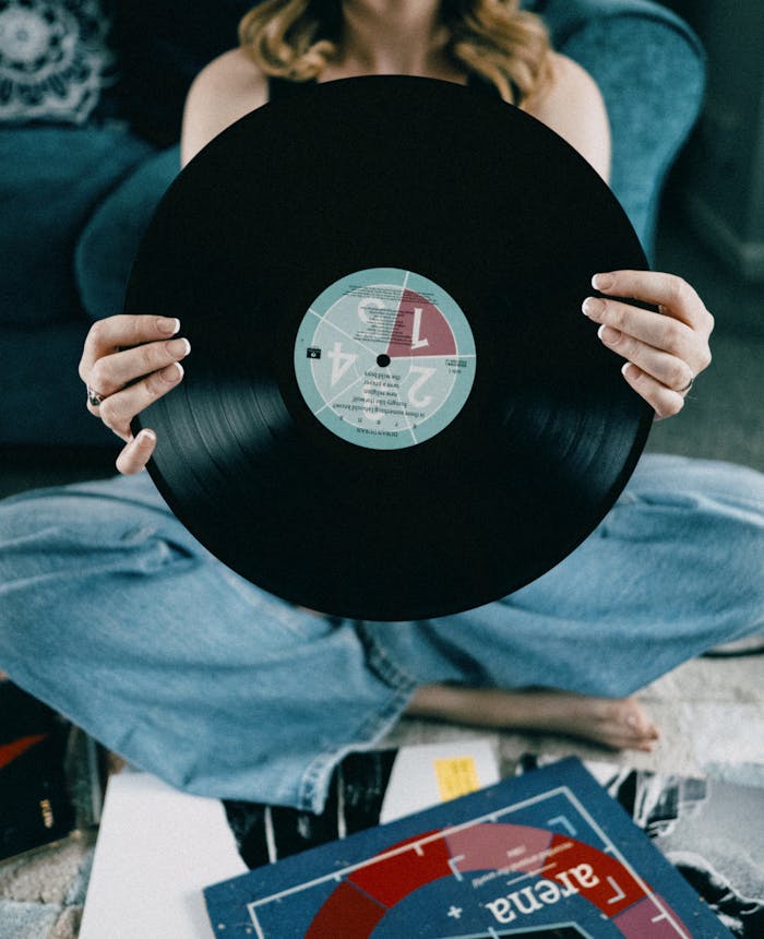 Woman Holding Vinyl Disk