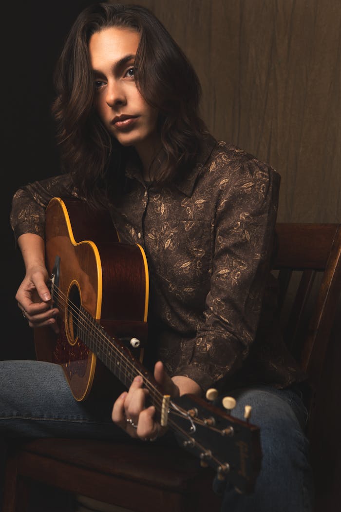 Young man playing an acoustic guitar